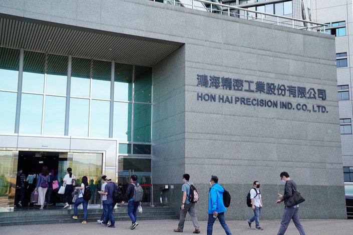 People enter the Hon Hai Precision Industry Co. headquarters ahead of the company's annual general meeting in New Taipei City, Taiwan, on June 23. Photo: Bloomberg