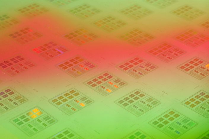 A silicon wafer made by TSMC is arranged for a photograph at the company's headquarters in Hsinchu on Jan. 30, 2008. Photo: Bloomberg
