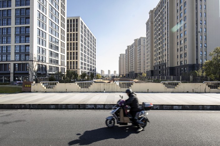 China’s restrictions on borrowing by property firms make it harder for them to tap the bond market. Photo: Bloomberg