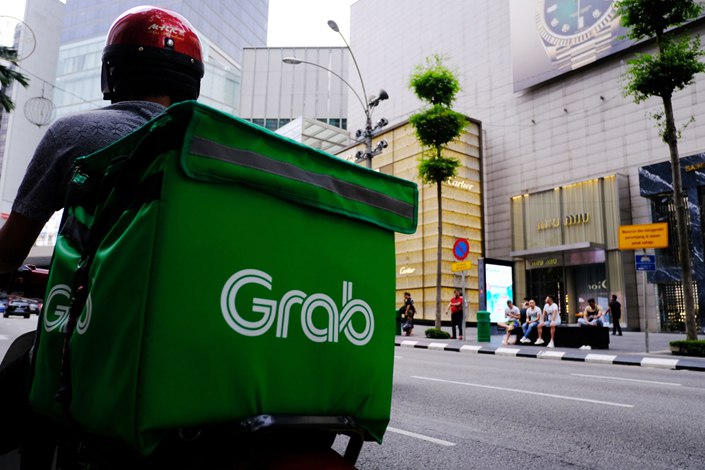 Southeast Asia’s ride-hailing and delivery giant Grab has plunged 63% since its debut. Photo: Bloomberg