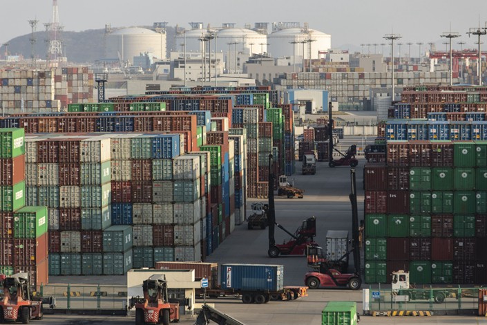 Shipping containers stand in stacks at the Yangshan Deepwater Port in Shanghai on Jan. 11. Photo: Bloomberg