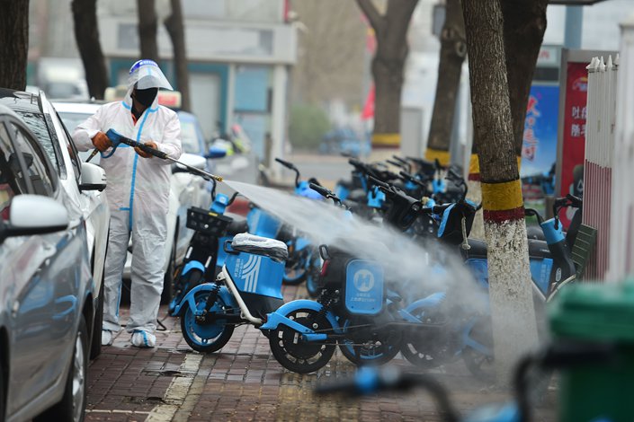 Sanitation workers carry out disinfection operations in Cangzhou, North China's Hebei province, on March 13. Photo: VCG