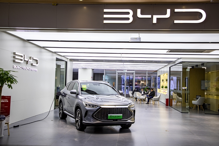 An electric vehicle gets charged up at a BYD dealership in Shanghai on Dec. 20. Photo: VCG