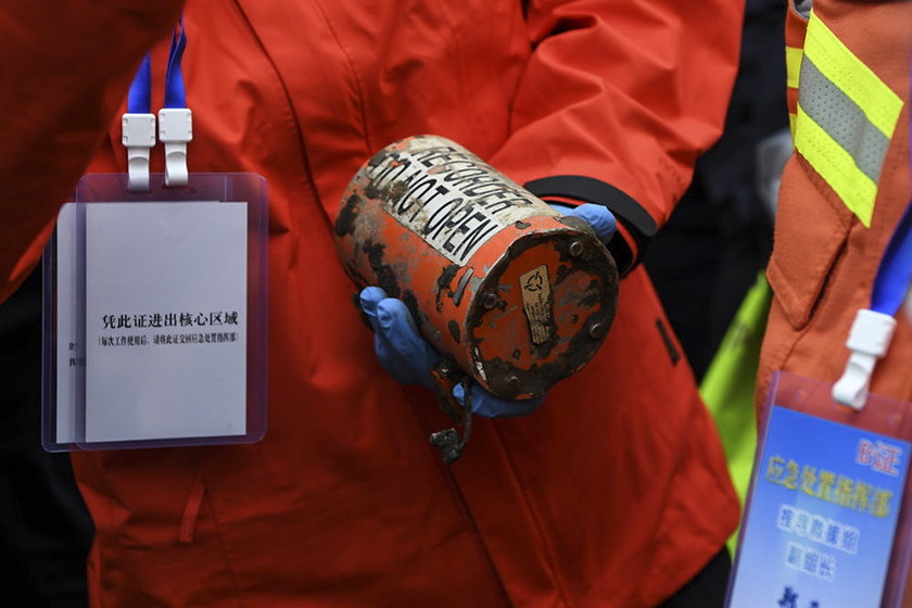 A rescuer holds the second black box that was recovered from the crashed China Eastern Airlines jet Sunday in Teng county, South China’s Guangxi Zhuang autonomous region. Photo: Xinhua