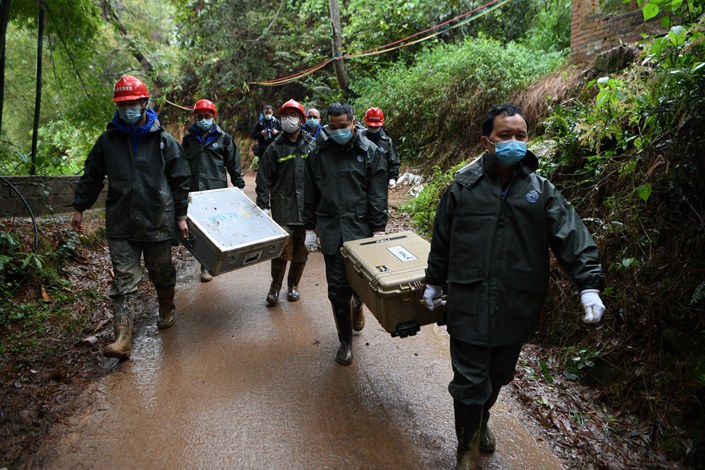 The flight-data recorder, which was buried some 40 meters from the main crash site near Wuzhou in southern China, was unearthed Sunday morning. Photo: Bloomberg