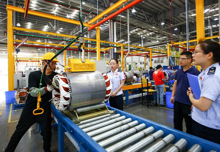 Tax bureau staff inspect work in a factory workshop in Changzhou, East China’s Jiangsu province, in June 2021. Photo: VCG
