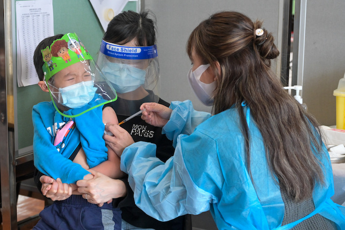 A child receiving a Covid-19 vaccination March 6 in Hong Kong.