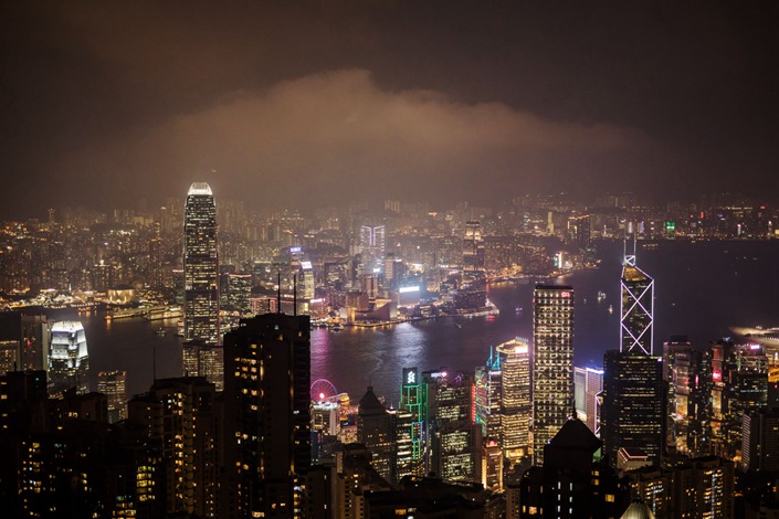 Victoria harbour and skyscrapers on the skyline of Hong Kong Island illuminated at dusk from Victoria Peak in Hong Kong. Photo: Bloomberg