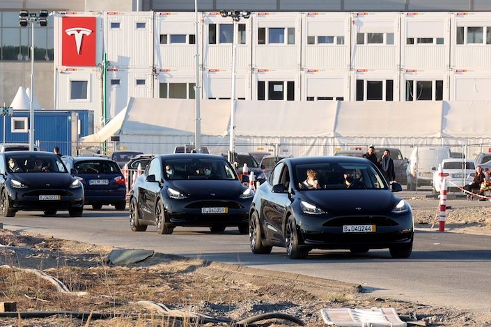 Model Y electric vehicles come off the production line depart the automaker's factory in Gruenheide on March 22.