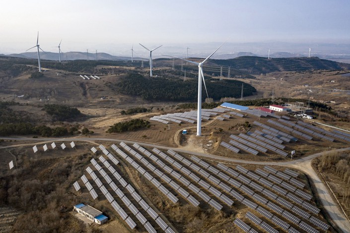 Wind turbines and solar panels in Liaoning province. Photo: Bloomberg