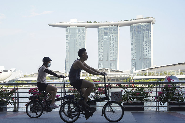 Singapore recently lifted most rules for fully vaccinated visitors and a requirement to wear masks outdoors. Photo: Bloomberg