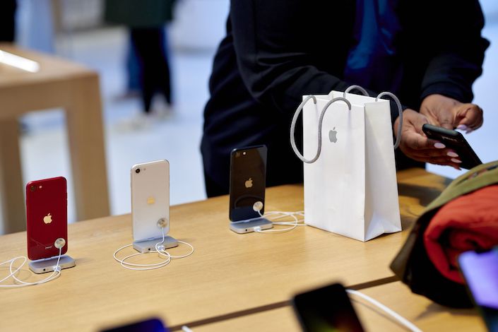 Apple shares slid after the iPhone maker said Covid-related disruptions in China will contribute to a revenue drop this quarter of $4 billion to $8 billion.
