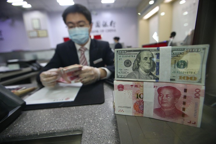 The People’s Bank of China has tentatively signaled that it wants to slow the yuan depreciation momentum. Photo: VCG