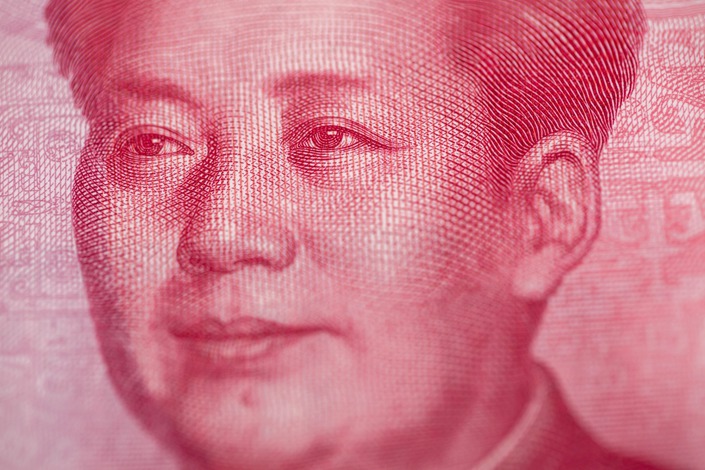 The portrait of former Chinese leader Mao Zedong is displayed on a 100 yuan banknote. Photo: Bloomberg