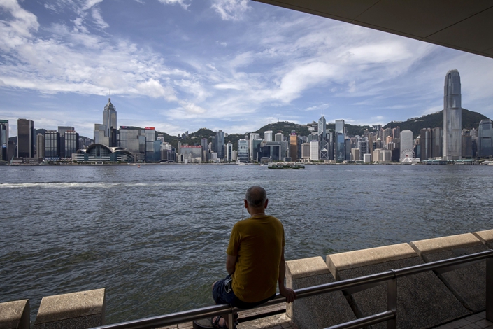 The Hong Kong Monetary Authority is expected to spend at least $16 billion defending the city’s currency peg as the dollar surges on U.S. rate hikes. Photo: Bloomberg