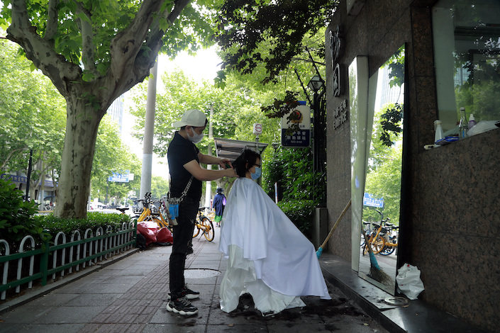 A barber offering haircuts for residents in Shanghai on May 19, 2022.