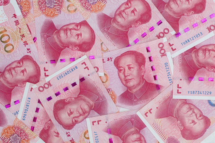 Chinese one-hundred yuan banknotes are arranged for a photograph in Hong Kong, China, on Thursday, April 23, 2020. Photo: Bloomberg