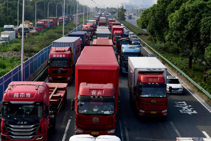 Freight trucks are seen on the Pudong Outer Ring Road in Shanghai, on Sept. 28, 2021. Photo: VCG