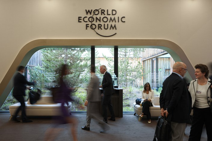 Participants walk through the Davos Congress Center, the venue of the annual meeting of the World Economic Forum in Davos, in Switzerland on May 23, 2022. Photo: VCG