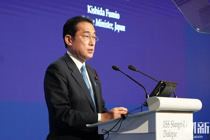 Japanese Prime Minister Fumio Kishida speaks at the 2022 Shangri-La dialogue summit in Singapore on Friday. Photo: Hai Yue/Caixin