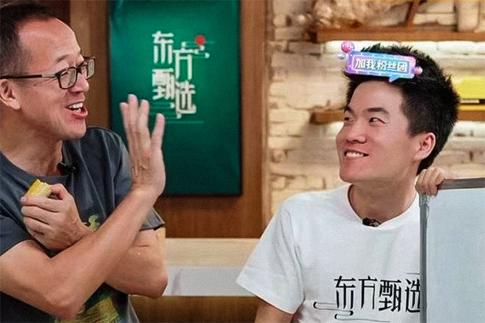 New Oriental Chairman Yu Minhong and one of the company's tutors host a livestreaming e-commerce session on June 10.