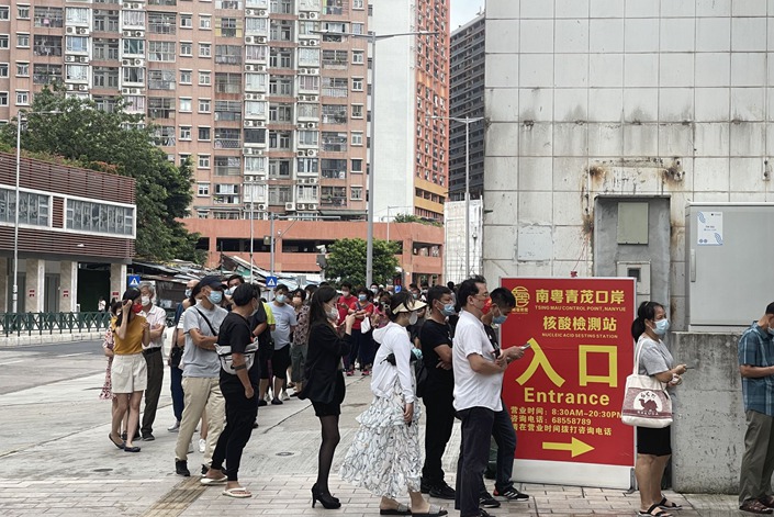 Residents line up to be tested for Covid-19 in Macao on June 19. Photo: Bloomberg