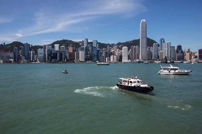 Boats sail across Victoria Harbour in front of the Hong Kong Island skyline on Aug. 5, 2019. Photo: Bloomberg