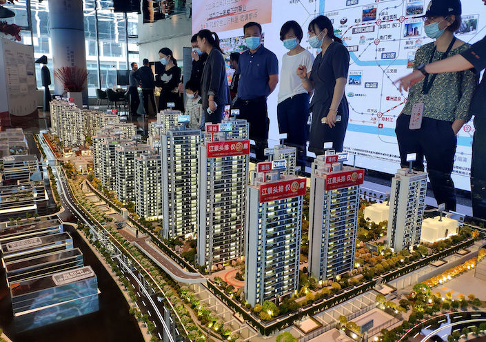 Visitors at a showroom for a new housing project in Fuzhou, Fujian province, on May 28, 2022.