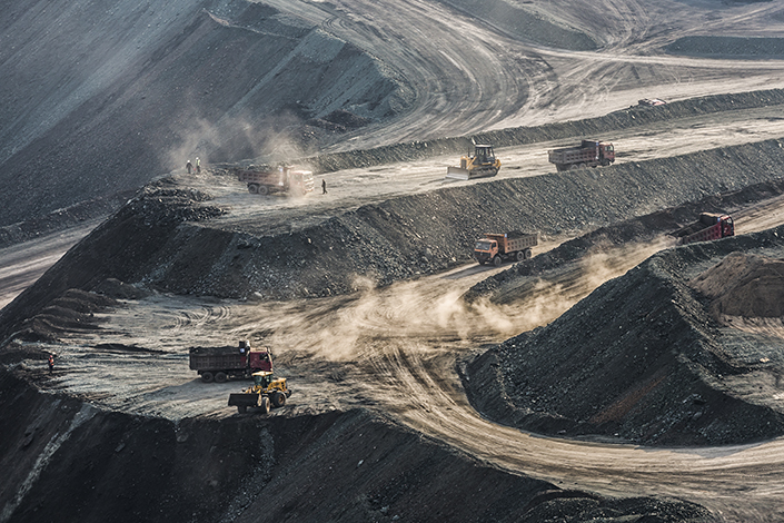 Trucks drive on an open-pit coal mine on April 3 in Fushun, Northeast China’s Liaoning province. Photo: VCG