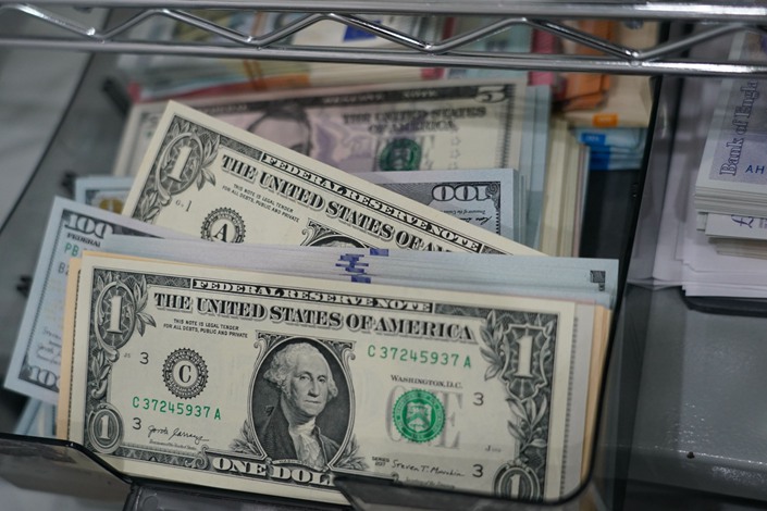 U.S. dollars banknotes at the Ninja Money Exchange, operated by Interbank HD, in the Shinjuku district of Tokyo, Japan, on June 9. Photo: Bloomberg