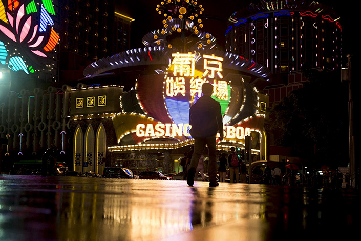 A man walks toward Casino Lisboa, operated by SJM Holdings, in Macao. Photo: Bloomberg