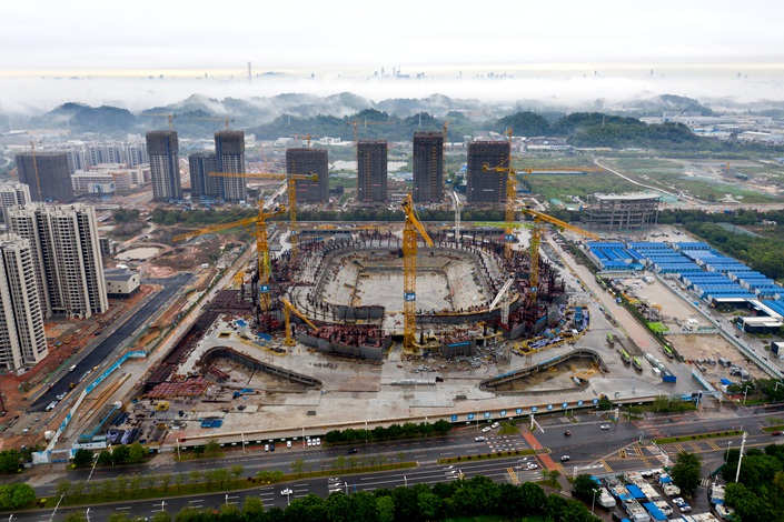 Evergrande’s under construction stadium on March 25, in Guangzhou. The 12 billion yuan, 100,000 seat stadium was to house the developer’s Chinese Super League team. Photo: VCG