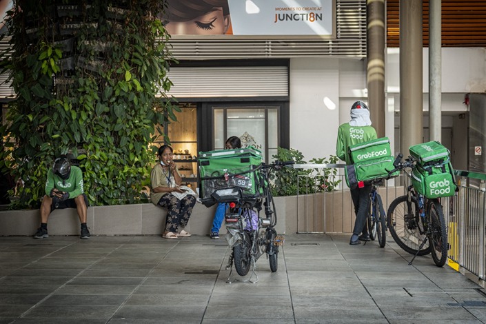 GrabFood delivery riders in Singapore on May 18. Photo: Bloomberg