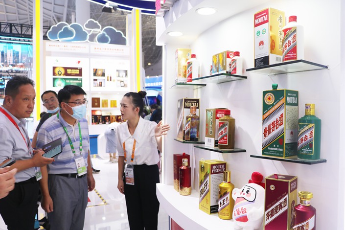 At the China International Consumer Goods Expo in Haikou, Hainan province, visitors check out the Maotai Group booth on July 27. Photo: VCG