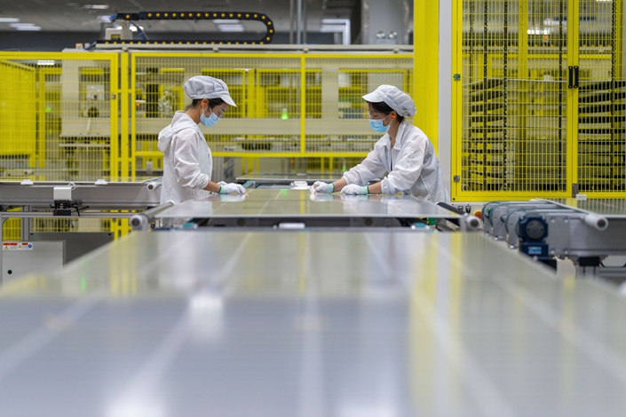 Solar panels are assembled at a factory in Hefei, Anhui province, on June 29. Photo: VCG