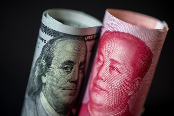 The People’s Bank of China set the yuan’s fixing at 6.9798 per dollar on Thursday, 850 pips stronger than the average estimate in a Bloomberg survey of analysts and traders. Photo: Bloomberg