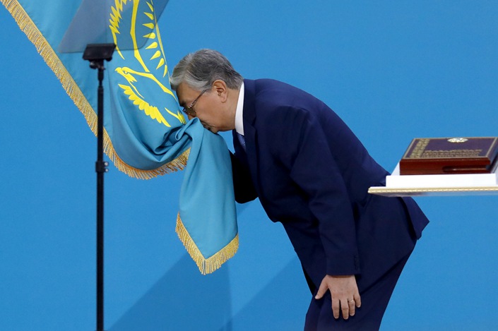 Kazakhstan's President Kassym-Jomart Tokayev kisses the national flag during his inauguration ceremony in Nur-Sultan, Kazakhstan on June 12, 2019. Photo: Valery Sharifulin/VCG