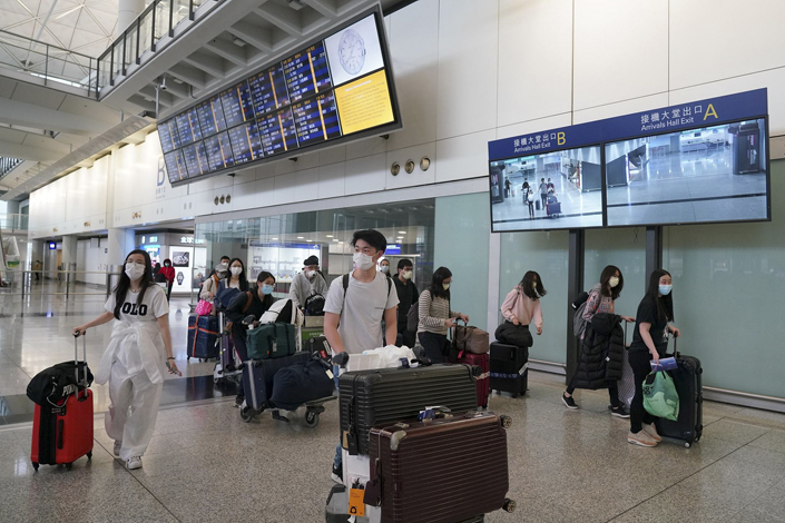 International students wait to board their flights at Hong Kong International Airport in 2020. Photo: VCG