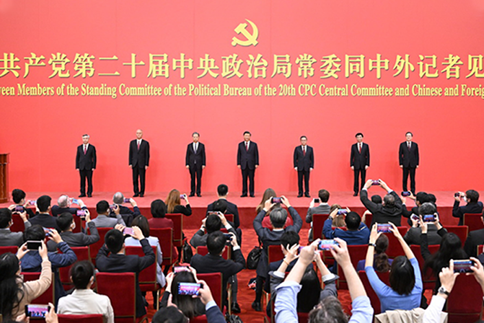 The newly elected members of the Standing Committee of the Political Bureau of the 20th CPC Central Committee meet the press at the Great Hall of the People in Beijing on Sunday. Photo: Xinhua