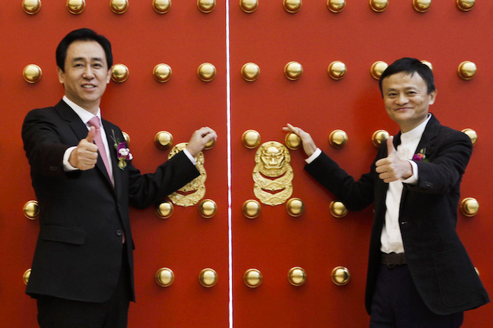 Jack Ma (right) and Hui Ka Yan (left) in Beijing on Nov. 6, 2015.