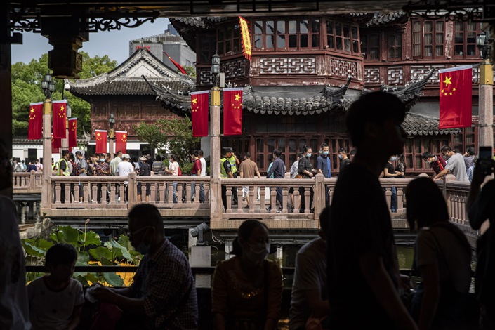 Visitors walk through Yuyuan Garden in Shanghai on Oct. 2.  Photo: Bloomberg
