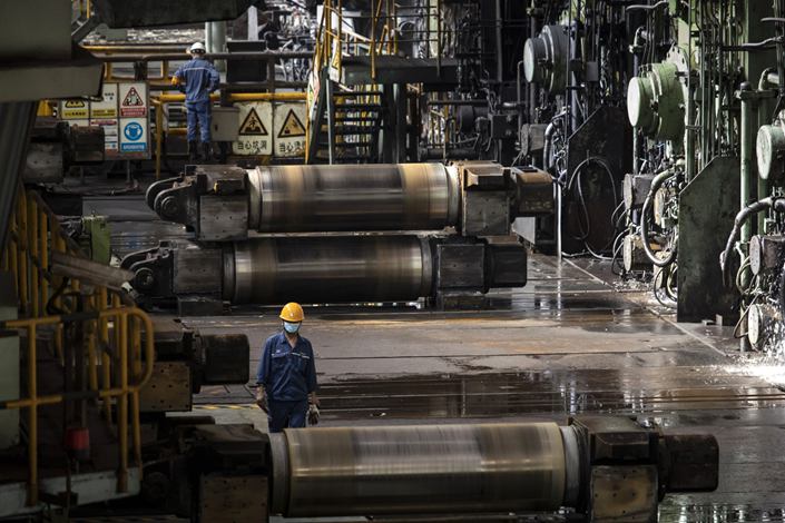 A worker walks through a hot-rolling workshop at Baowu Steel’s Baoshan production facility in Shanghai on Sept. 16. Photo: Bloomberg