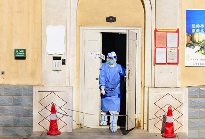 Medical staff members walk out of a residential community in Hohhot in North China’s Inner Mongolian autonomous region. Photo: VCG