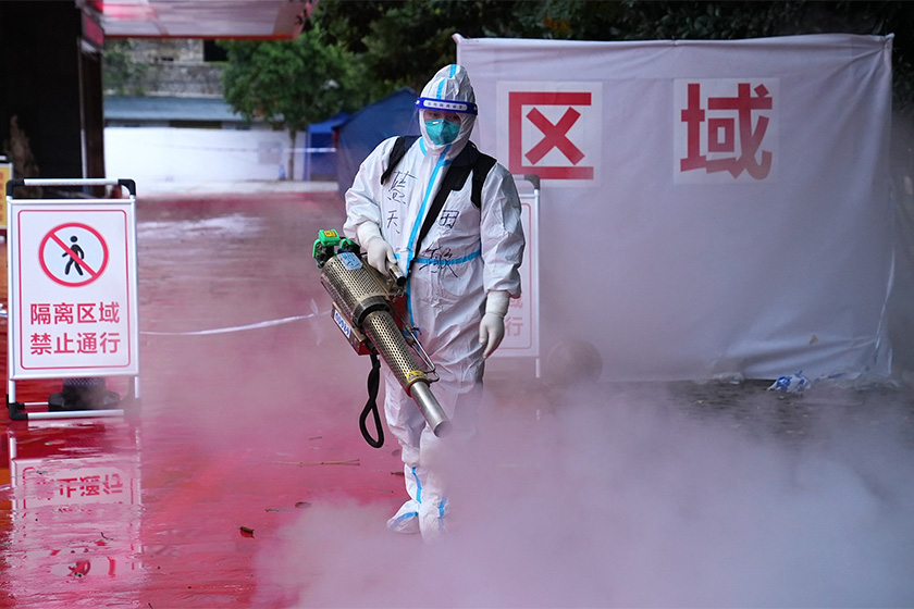A volunteer disinfects a quarantine area in Chongqing on Wednesday. Photo: VCG