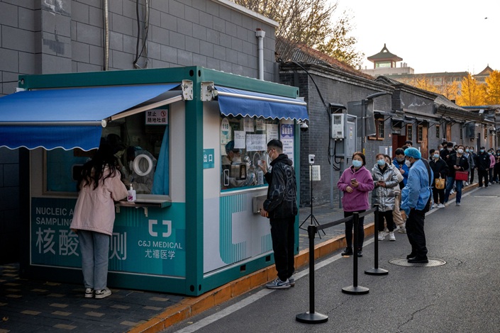 Residents line up at a Covid-19 testing booth in Beijing on Nov. 14. Photo: Bloomberg