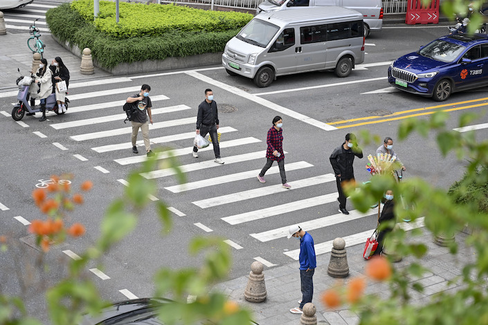 Pedestrians in the Haizhu District of Guangzhou on Nov. 30, 2022.