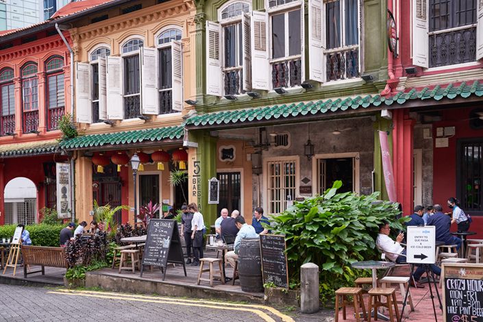 Customers gather at Peranakan shophouse bars in Singapore. Photo: Bloomberg