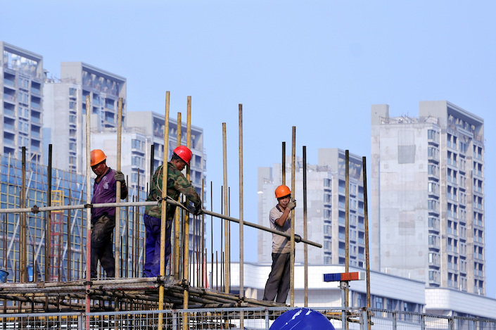 Construction workers at the site of a new residential development in Changzhou, Jiangsu province, on Sept. 11, 2022.