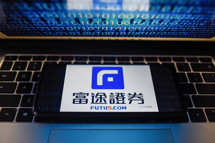 The Futu Holdings logo displayed on a smartphone. Photo: Bloomberg