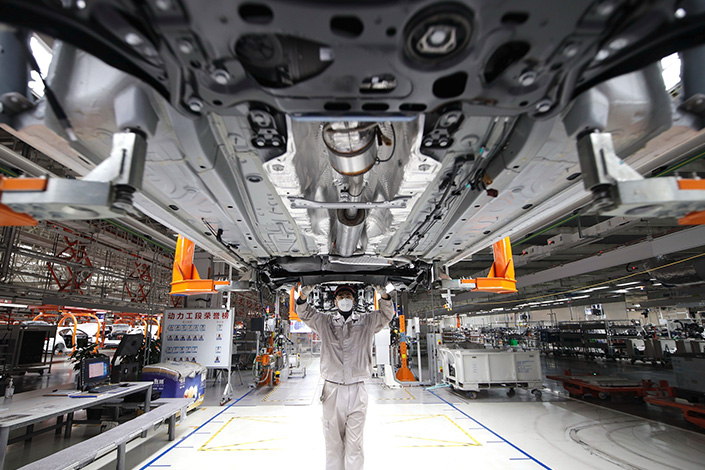 A worker assembles a vehicle Tuesday at a factory in Qingdao, East China’s Shandong province. Photo: VCG
